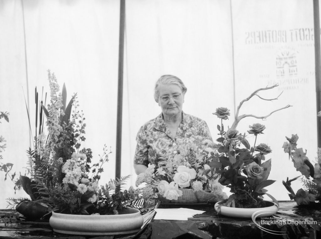 Dagenham Town Show 1966 at Central Park, showing Mrs Lynch with Flower Arrangement Society Alpine exhibit in Visual Arts display, 1966