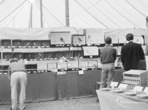 Dagenham Town Show 1966 at Central Park, showing people looking at birds in several small cages on Caged Birds stand, 1966