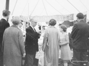 Dagenham Town Show 1966 at Central Park, showing Barking Photographic Society display, with onlookers at photographic session, 1966