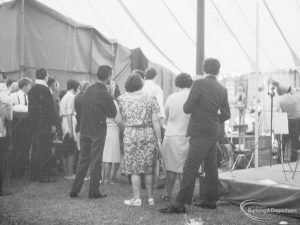 Dagenham Town Show 1966 at Central Park, showing Visual Arts Display, with onlookers watching portrait painting by artists from Barking Art Society, 1966