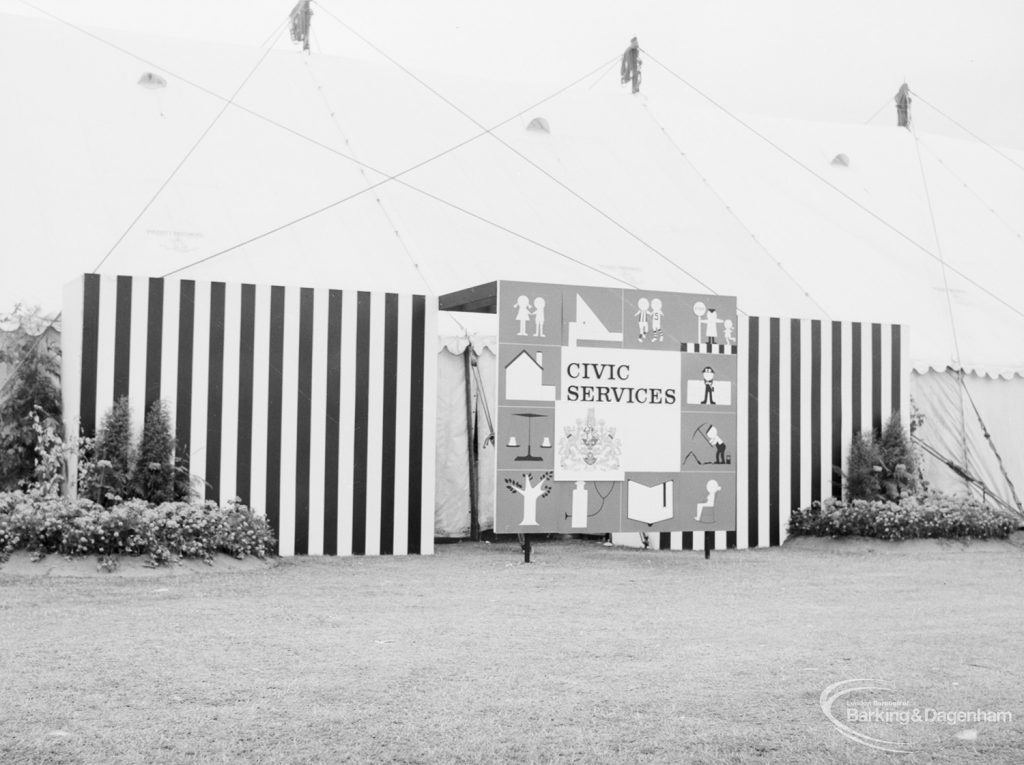 Dagenham Town Show 1966 at Central Park, showing entrance to Civic Services marquee, with sign board, flowers and striped boards, 1966