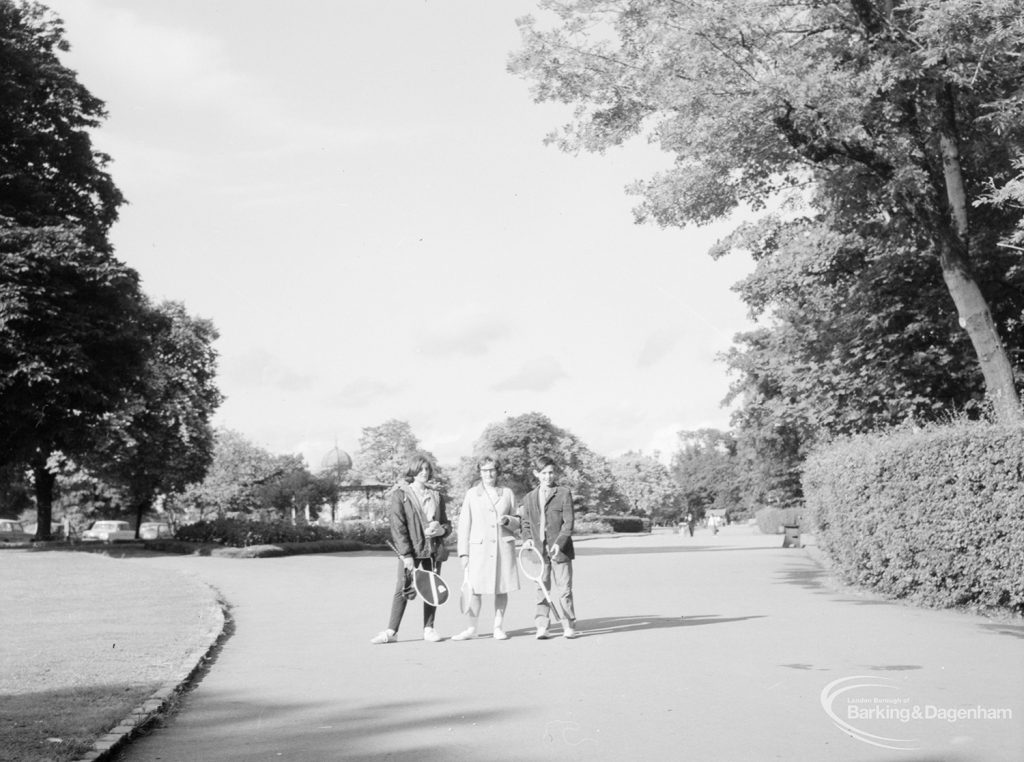 Valentines Park, Ilford, showing group of three people on path, 1966