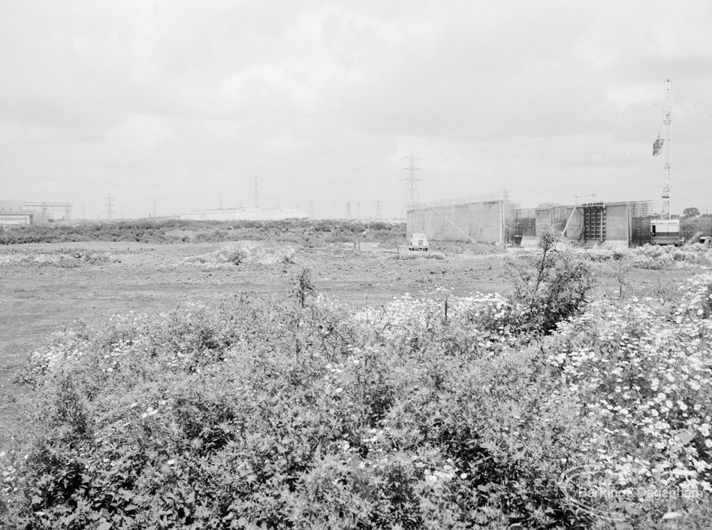 Riverside Sewage Works Reconstruction XII, showing panoramic view of undeveloped area, with rough dirt tracks amongst wild flowers and with industrial buildings on horizon [sequence running from left to right EES11459 – 60 – 66 – 65 – 62 – 67 – 63 – 64 – EES11461], 1966