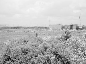 Riverside Sewage Works Reconstruction XII, showing panoramic view of undeveloped area, with rough dirt tracks amongst wild flowers and with industrial buildings on horizon [sequence running from left to right EES11459 – 60 – 66 – 65 – 62 – 67 – 63 – 64 – EES11461], 1966