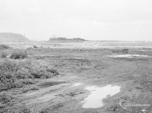 Riverside Sewage Works Reconstruction XII, showing panoramic view of undeveloped area, with rough dirt tracks amongst wild flowers and with industrial buildings on horizon [sequence running from left to right EES11459 – 60 – 66 – 65 – 62 – 67 – 63 – 64 – EES11461], 1966