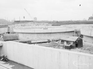 Riverside Sewage Works Reconstruction XII, showing sludge tanks and wall, 1966