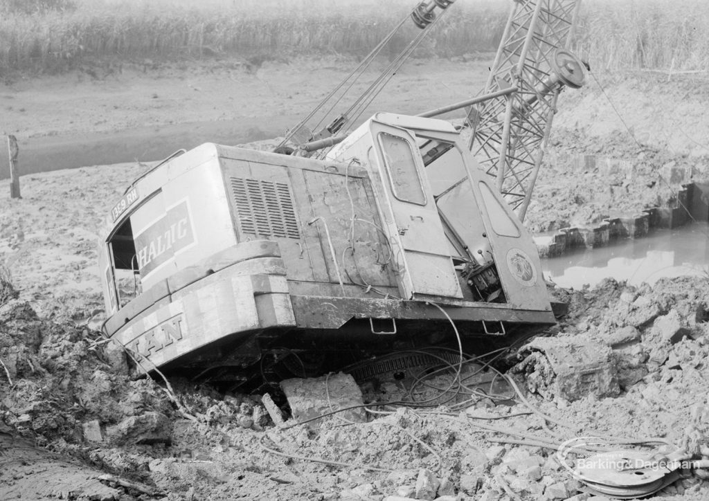 Riverside Sewage Works Reconstruction, showing Hadsphaltic digger submerged in mud in creek, seen from landward side, 1966