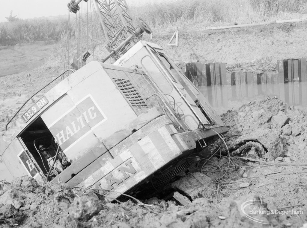 Riverside Sewage Works Reconstruction, showing rear end [engine] of Hadsphaltic digger submerged in clay, 1966