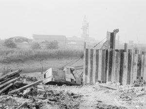 Riverside Sewage Works Reconstruction, showing position beyond higher fence of Hadsphaltic digger submerged in clay, 1966