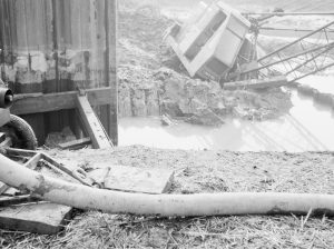 Riverside Sewage Works Reconstruction, showing Hadsphaltic digger submerged in clay, seen from across the creek, 1966