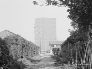 Housing, showing Thaxted House, Siviter Way, Dagenham from west, framed in trees and taken from footpath, 1966
