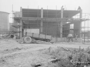 Riverside Sewage Works Extension XIII, showing open end of multi-storey building, with digester at left, 1966