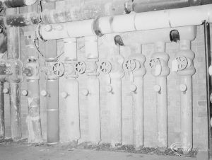 Heating, showing six vertical pipes with hand valve cocks at Heath Park substation, 1966