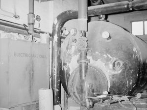 Heating, showing end of large boiler and cabinet marked ‘Electricians Only’ at Heath Park substation, 1966