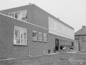Health, showing exterior of rebuilt Ashton Road Clinic, Chadwell Heath, east side in Ashton Gardens with prams, taken from south-east, 1966