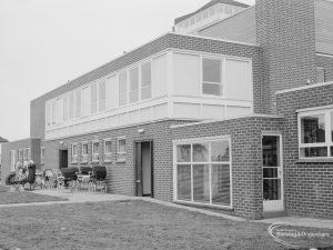 Health, showing exterior of rebuilt Ashton Road Clinic, Chadwell Heath, east side in Ashton Gardens with prams, taken from north-east, 1966