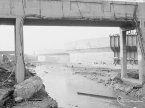 Riverside Sewage Works Reconstruction XIV, showing view of unbanked stream below conduit, 1966