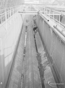 Riverside Sewage Works Reconstruction XIV, showing full length of empty conduit carried on stilts, 1966