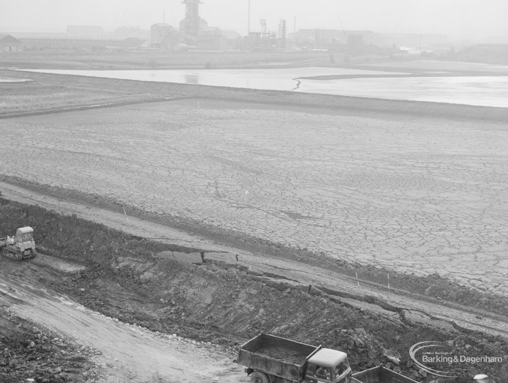 Riverside Sewage Works Reconstruction XIV, showing cracked smooth mud and dyke [see also EES11722], taken from above, 1966