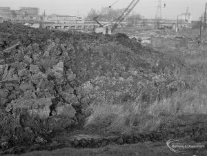 Riverside Sewage Works Reconstruction XIV, showing spoil from excavation, with elevated conduit in distance, 1966