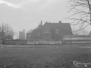 Barking Church of England School, later known as St. Margaret’s Church of England School, Back Lane, Barking, showing main school building and St Margaret’s Church in background (at left), 1967