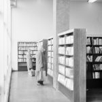 London Borough of Havering Central Library, Romford, showing readers at bookcases by windows, 1967