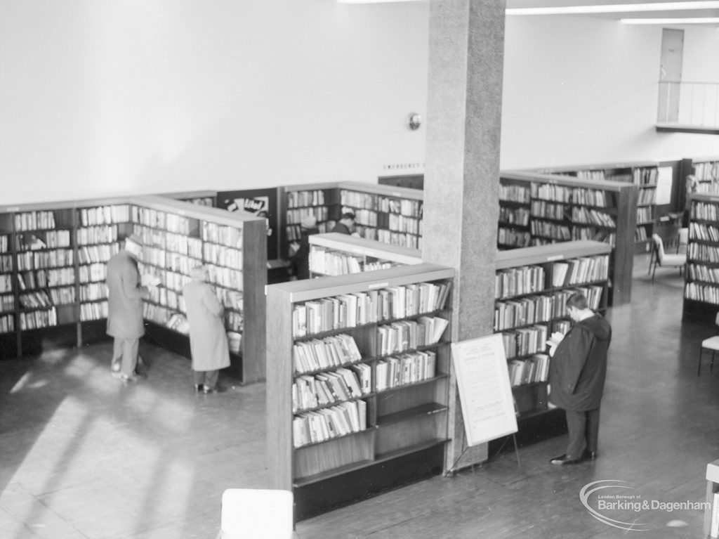 London Borough of Havering Central Library, Romford, showing part of the lending department [area to right of EES11822], with bookcases and library users, 1967