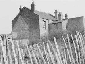 Crown Street, Old Dagenham Village, showing old chimneyed house near east end, beyond palings, 1967