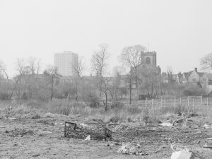 Crown Street, Old Dagenham Village, showing devastated waste ground, looking west to Dagenham Parish Church, 1967