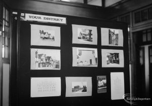 Victoria and Albert Vanishing History exhibition at Rectory Library, Dagenham, showing display stand with Your District local photographs, 1967