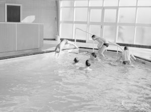 Swimming pool at Faircross Special School, Hulse Avenue, Barking, showing boys diving from corner of pool, 1967