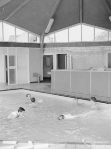 Swimming pool at Faircross Special School, Hulse Avenue, Barking, showing boys swimming and roof of pool, 1967