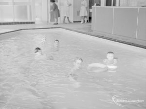 Swimming pool at Faircross Special School, Hulse Avenue, Barking, showing boys with rubber ring, 1967