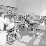 Faircross Special School, Hulse Avenue, Barking, showing class of children with teacher and wheelchair user, 1967