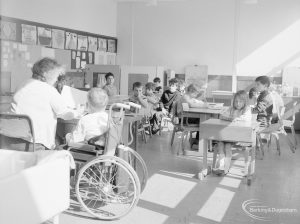 Faircross Special School, Hulse Avenue, Barking, showing class of children with teacher and wheelchair user, 1967