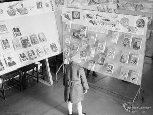 Barking Libraries Children’s Book Week at Valence House, Dagenham, showing small child looking at ‘Men of Science’ display stand, 1967
