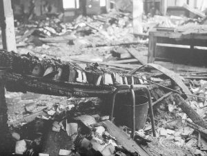 Fire at Barking Central Library, showing remains of issue tray desks, looking to north-west corner, 1967