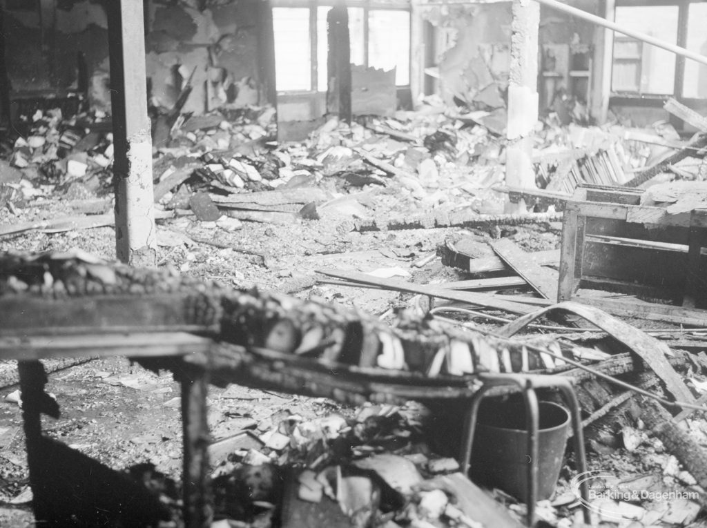 Fire at Barking Central Library, showing wrecked and burnt issue tray desks, 1967