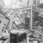 Fire at Barking Central Library, showing tangle of girders, counter and roofing on ground floor, 1967