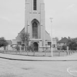 Lighting, showing locally designed lamp-posts flanking triangular green in front of Saint Alban’s Church, at junction of Urswick Road and Vincent Road, Dagenham, 1967