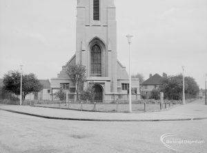 Lighting, showing locally designed lamp-posts flanking triangular green in front of Saint Alban’s Church, at junction of Urswick Road and Vincent Road, Dagenham, 1967