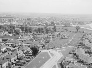 Housing, showing view from Thaxted House, Siviter Way, Dagenham of Dagenham Parish Church (left), Siviter Way, St Giles Avenue and Rainham Road South (at top), 1967