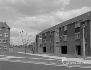 Housing development at John Burns Drive, showing three-storey dwellings with projecting rooms, set back and contrasting with other buildings, 1967