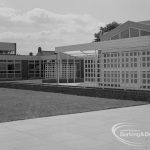Faircross Special School, Barking, showing screenwork with white-painted wood round swimming pool building, 1967