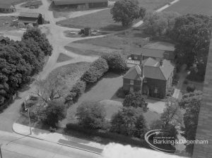 View from roof of Highview House, Hatch Grove, Chadwell Heath looking downwards and east to Crown Farm, with farmhouse, garden and barns, 1967