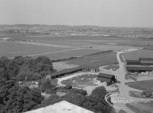 View from roof of Highview House, Hatch Grove, Chadwell Heath of outbuildings of Crown Farm and fields looking towards Havering-atte-Bower, 1967