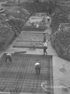 Sewage Works Reconstruction (Riverside Treatment Works) XVIII, showing men laying steel rods in rectangular foundation, 1967