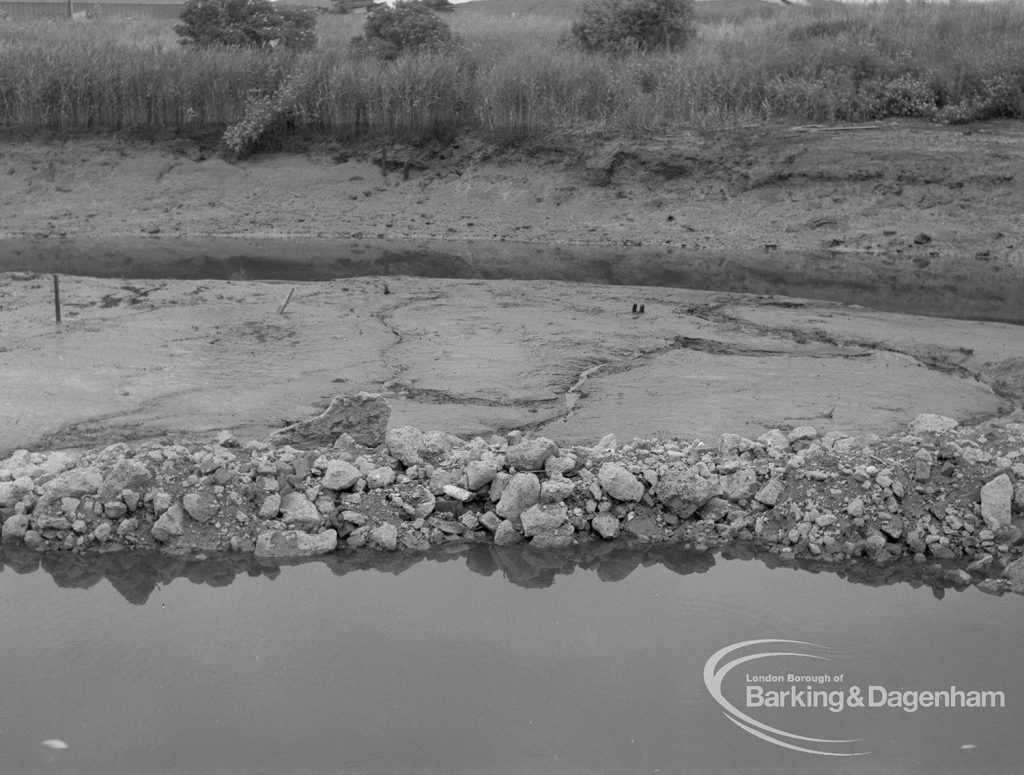 Sewage Works Reconstruction (Riverside Treatment Works) XVIII, showing outfall-banks exposed at low tide, with reeds, bank of creek, water, barrage and pool, 1967