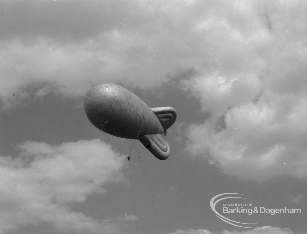 Dagenham Town Show 1967, showing a captive balloon high among clouds, 1967