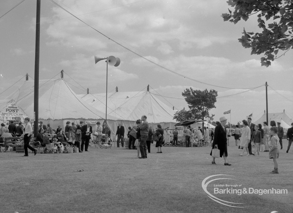 Dagenham Town Show 1967, showing the ?Barking and Dagenham Post? and other marquees, and visitors strolling along avenue, 1967